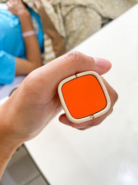 Close-up of woman hand holding smart phone