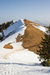 Scenic view of snow covered mountain against sky