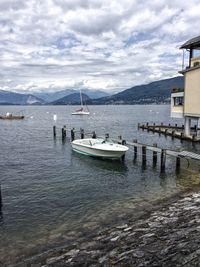 Sailboats in sea against sky