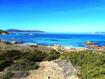 Scenic view of sea against clear blue sky