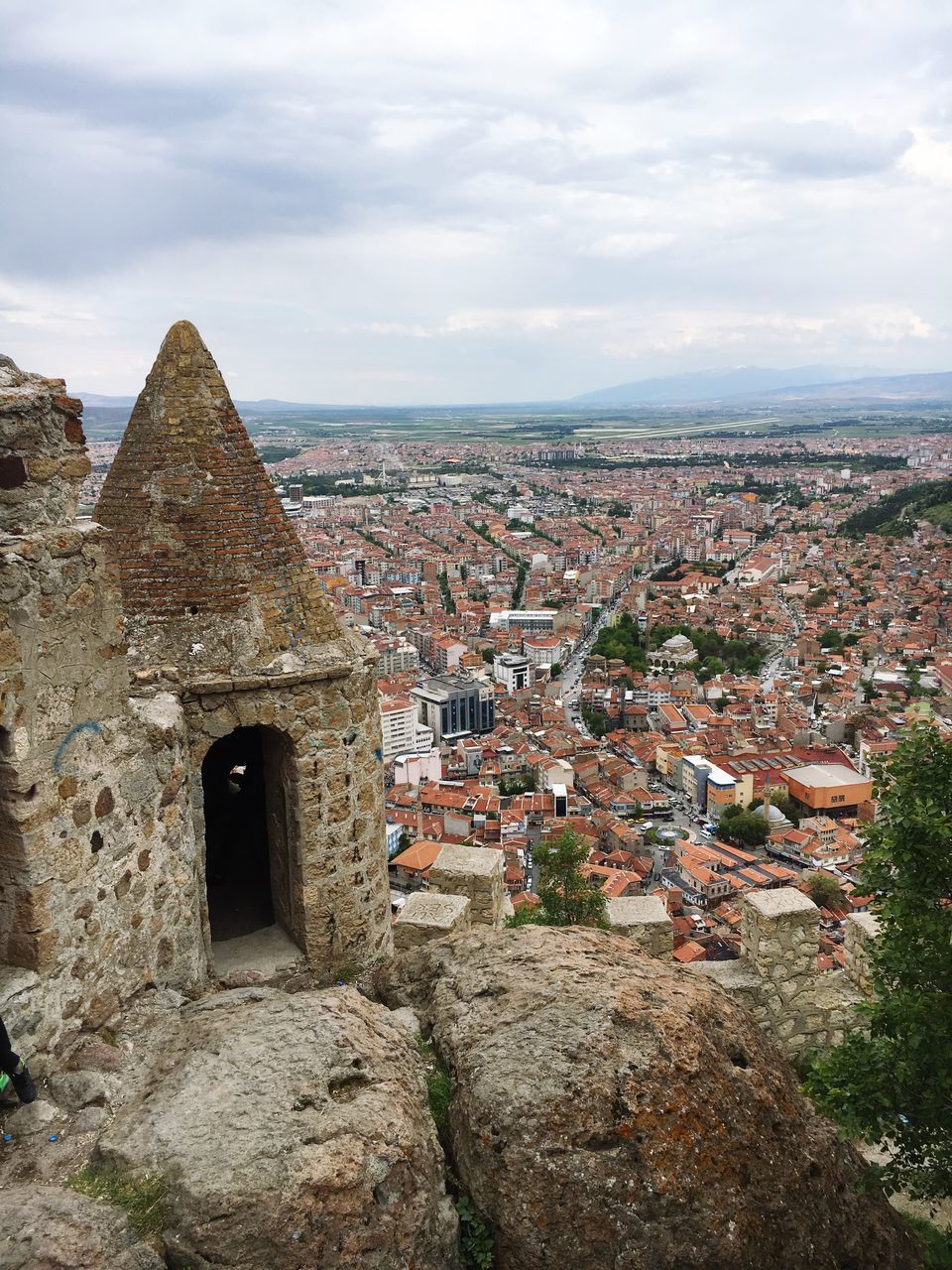 architecture, built structure, building exterior, sky, history, cloud - sky, the past, old ruin, old, cloudy, stone wall, cityscape, ancient, high angle view, town, cloud, day, house, crowded, residential district