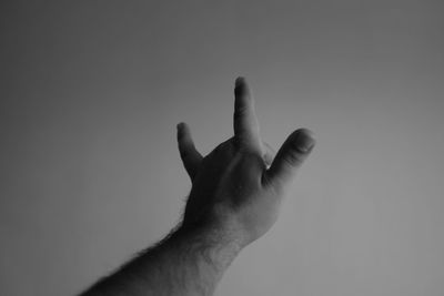 Close-up of human hand against white background