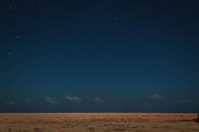 Scenic view of sea against sky at night