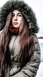 Portrait of young woman in snow