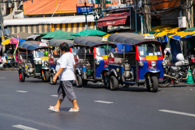 People on road in city