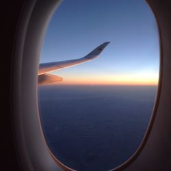 Scenic view of sea seen through airplane window