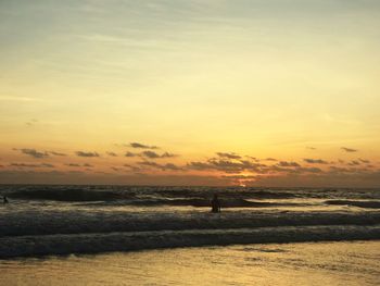 Scenic view of beach against sky during sunset