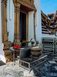 Potted plants on table outside building