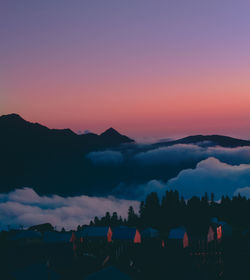 Scenic view of silhouette mountains against sky during sunset