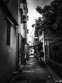 Narrow alley amidst buildings in city