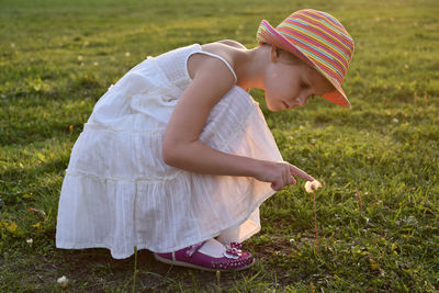 Side view of a girl on field