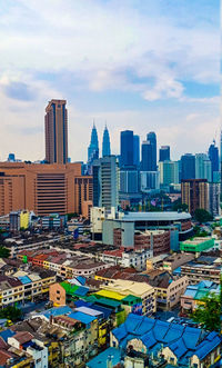 Modern buildings in city against sky