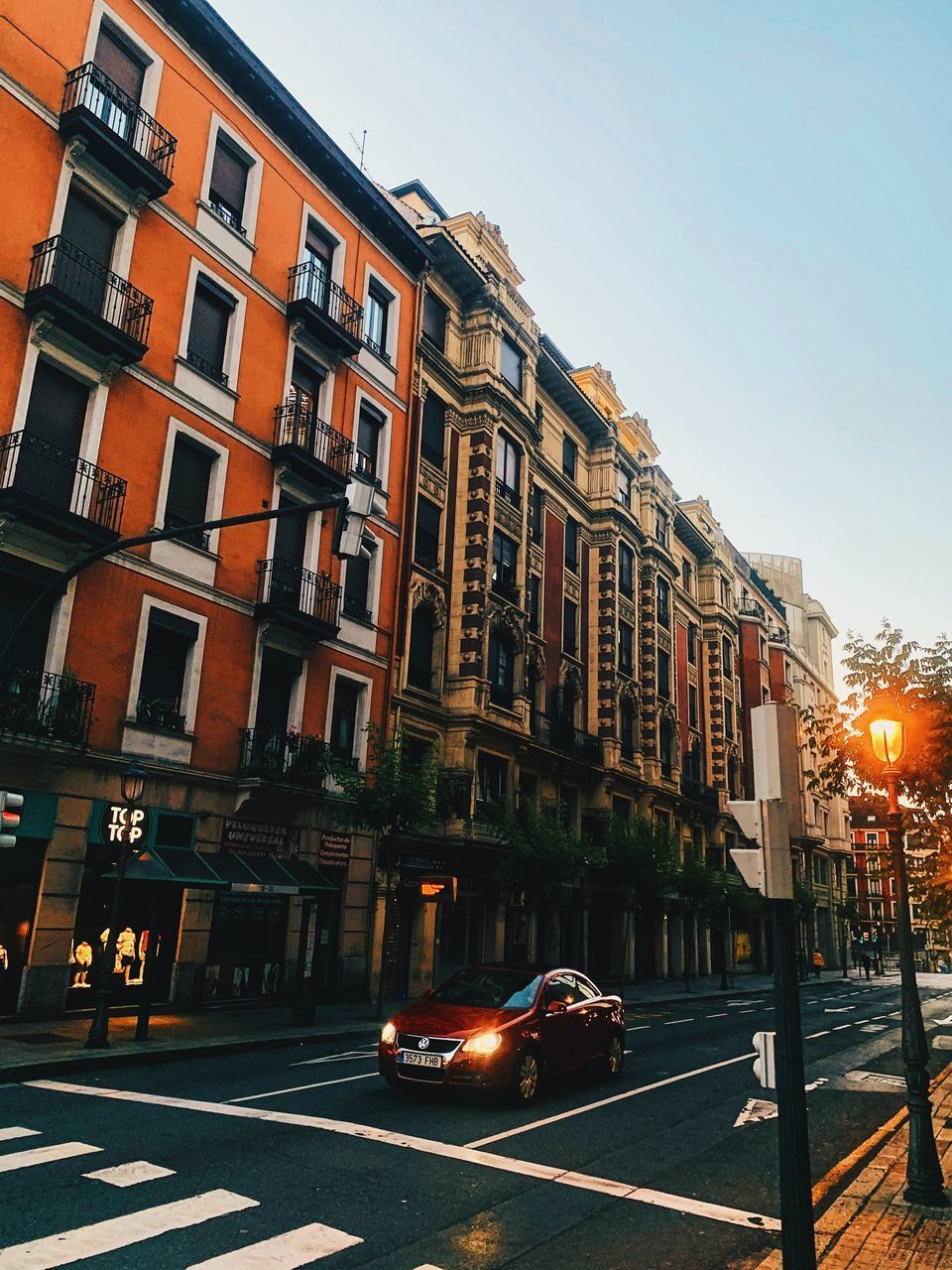 CITY STREET AND BUILDINGS AGAINST SKY