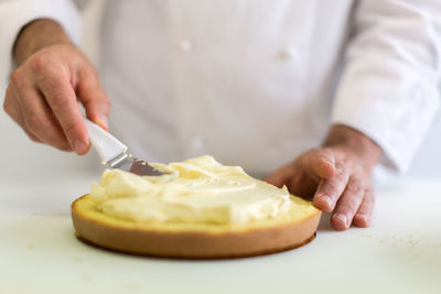 Close-up of man preparing food