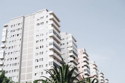 Low angle view of buildings against clear sky