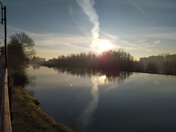 Scenic view of lake against sky during sunset