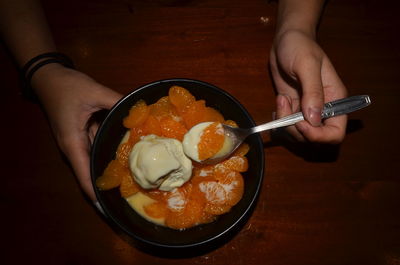 Midsection of man holding ice cream