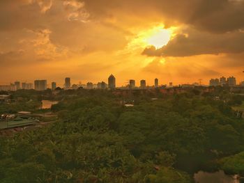 Scenic view of buildings against sky during sunset