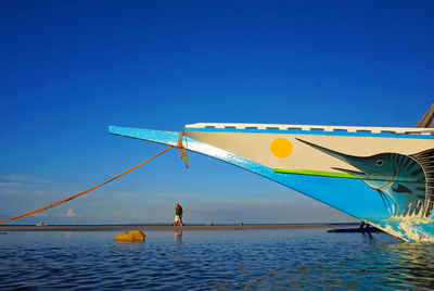 Couple walking near boat