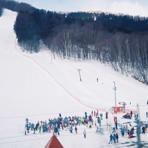 High angle view of people on snow covered landscape