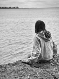 Rear view of woman looking at sea