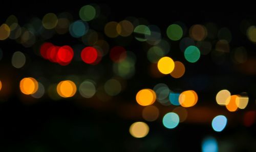 Defocused image of illuminated lights at night