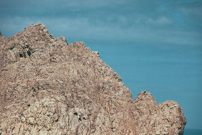 Rock formation against blue sky