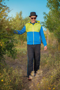 Rear view of man standing in forest