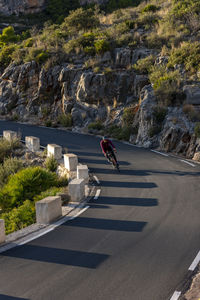 Man riding motorcycle on road