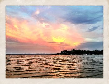 Scenic view of sea at sunset