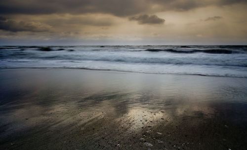 Scenic view of sea against sky at sunset