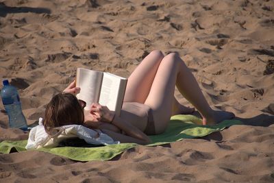 People relaxing on beach