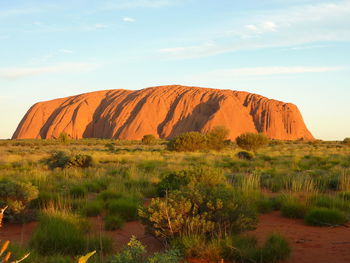 Rock formations on landscape against sky