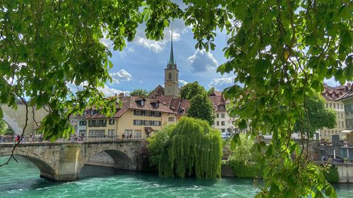 River amidst buildings against sky