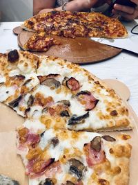 Close-up of pizza served on table