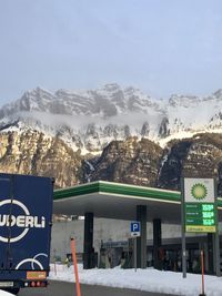 Scenic view of snow covered mountains against sky