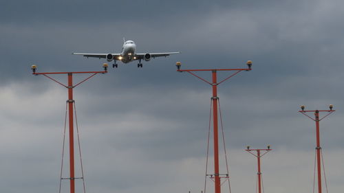 Low angle view of airplane flying in sky