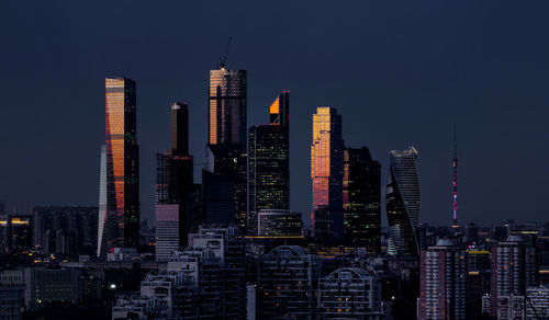 Illuminated modern buildings in city