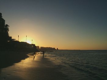 Scenic view of sea at sunset