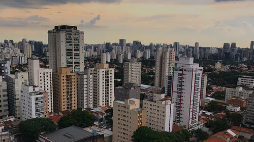 High angle view of buildings in city against sky