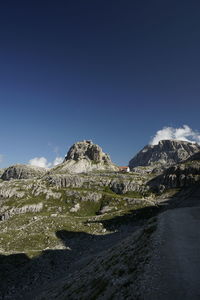 Scenic view of mountains against clear blue sky