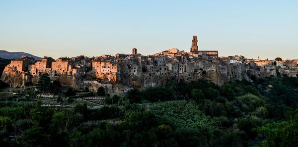 View of old buildings against clear sky