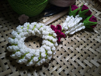 High angle view of flowering plant in basket on table