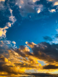 Low angle view of dramatic sky during sunset