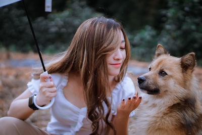 Close-up of woman with dog