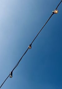 Low angle view of street light against clear sky