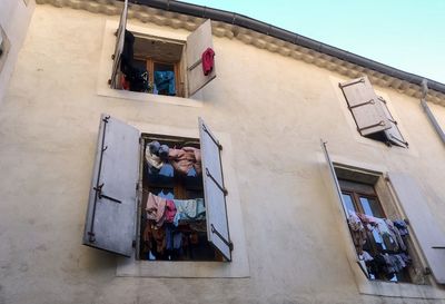 Colourful laundry drying at the windows