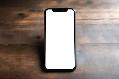 High angle view of mobile phone on table