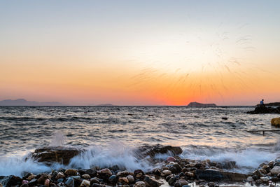 Scenic view of sea against sky during sunset