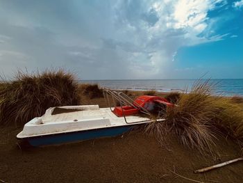 Boat in sea against sky